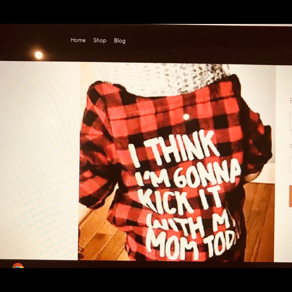 Boys or girls black and white checkered shirt.